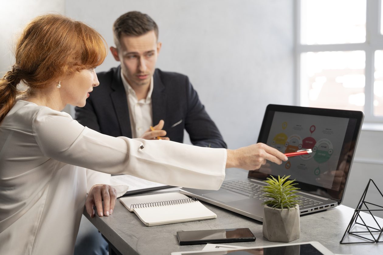 Advertising consultants reviewing campaign results